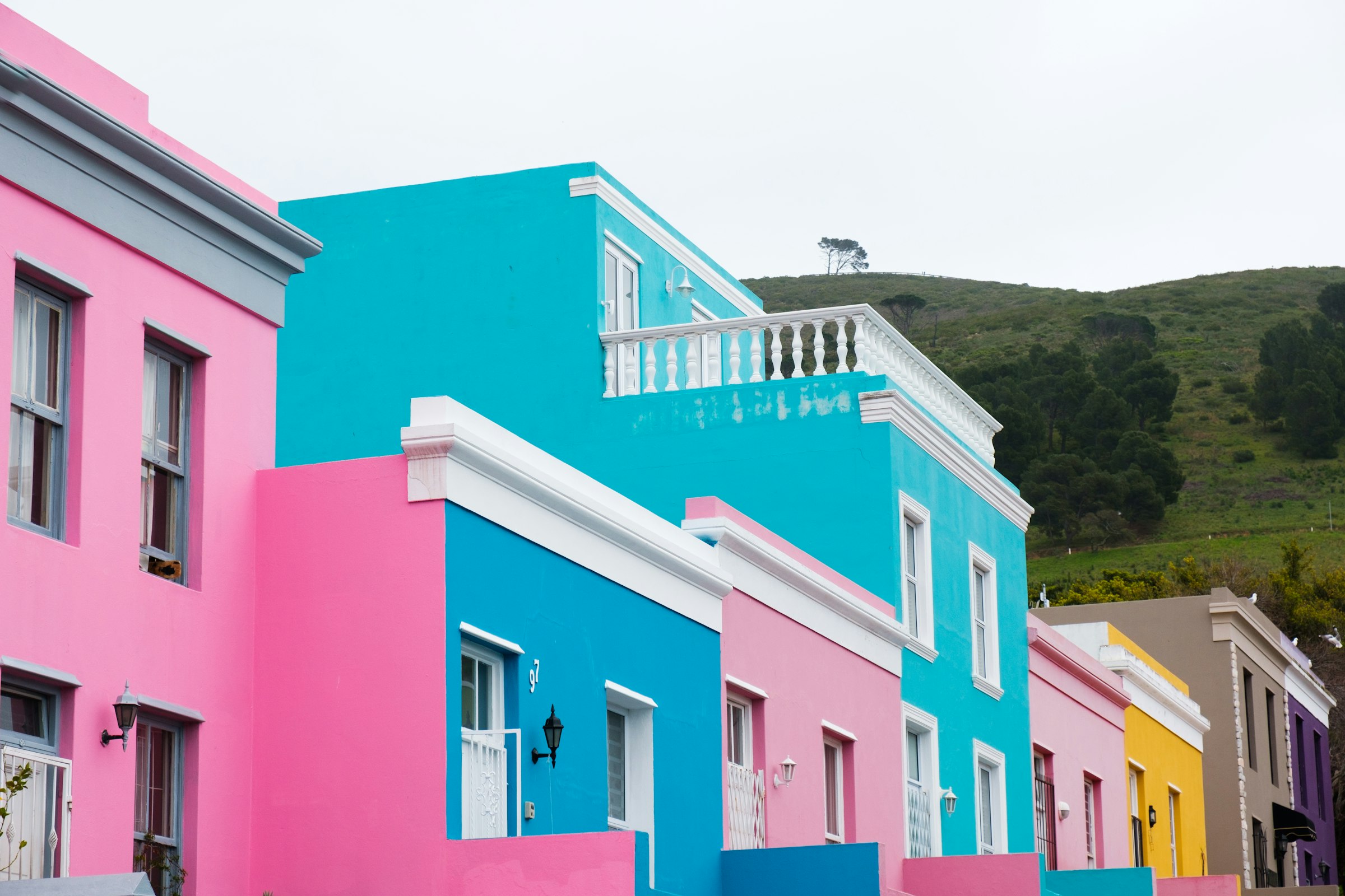Painted houses in the Bo-Kaap, on the slope above the city centre. The course passes a few hundred metres below, after the Gardens climb. Photograph: Joshua Kettle, Unsplash.
