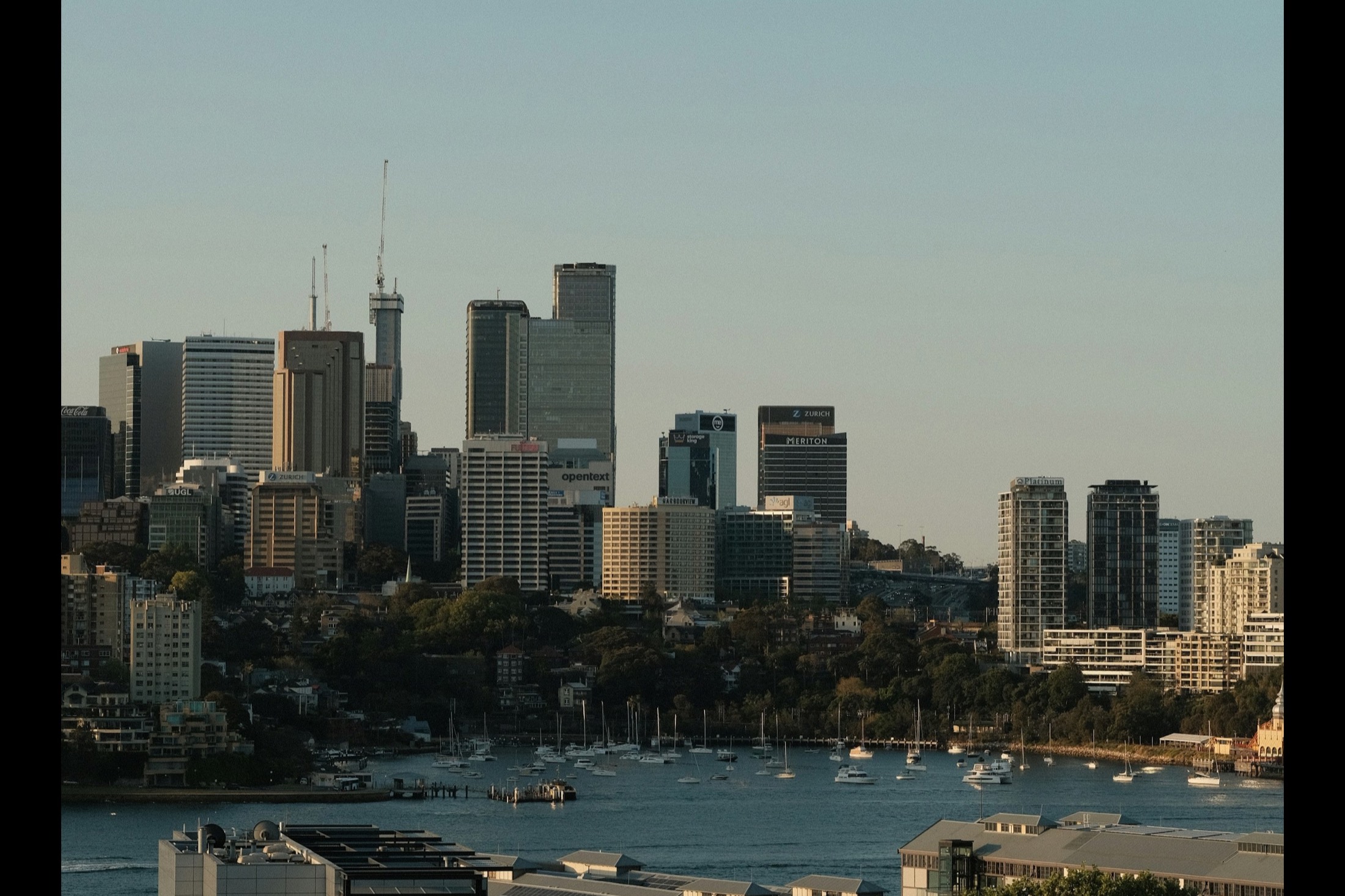 Sydney office towers and the harbour at sunset, seen from Observatory Hill at Millers Point.